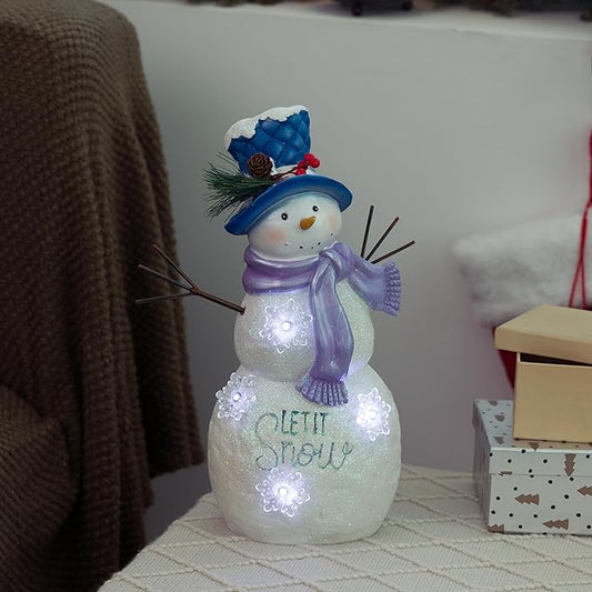 Alpine Corporation 14”H Lavender Winter "Let It Snow" Snowman Statue with Fading LED Lights, Christmas Decor